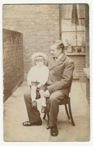 Sitting on his father Karl's knee Sitting on his father Karl's knee